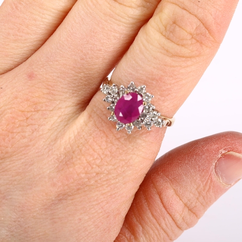 423 - A modern 9ct gold ruby and diamond cluster dress ring, set with oval mixed-cut ruby and modern round... 