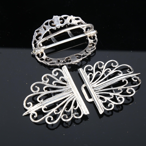 424 - A late Victorian silver nurse's buckle, and a small silver plated buckle, largest length 11cm (2)