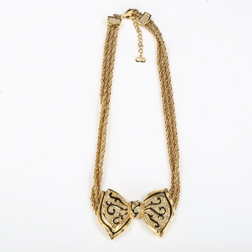 439 - CHRISTIAN DIOR - a Vintage gold plated ribbon bow tie necklace, black enamel and paste accents, leng... 