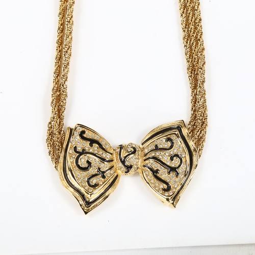 439 - CHRISTIAN DIOR - a Vintage gold plated ribbon bow tie necklace, black enamel and paste accents, leng... 