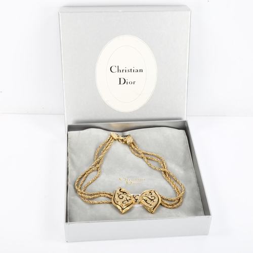 439 - CHRISTIAN DIOR - a Vintage gold plated ribbon bow tie necklace, black enamel and paste accents, leng... 