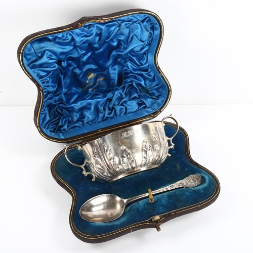 441 - A cased Victorian silver porringer and spoon eating set, relief embossed acanthus leaf decoration, b... 