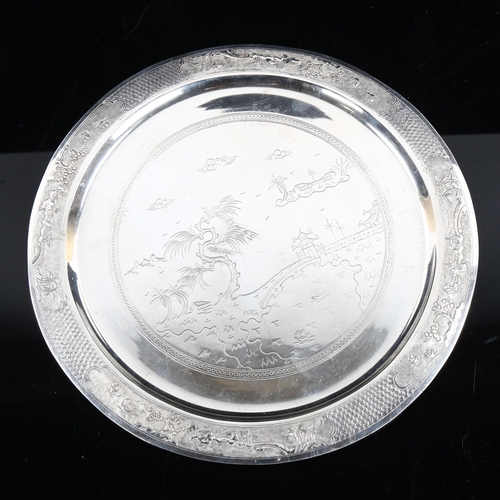 472 - **DESCRIPTION CHANGE** An *American* silver salver, engraved decoration, stamped MET, diameter 24cm,... 