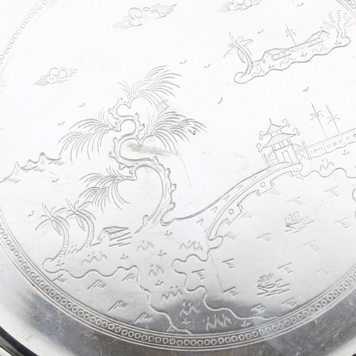 472 - **DESCRIPTION CHANGE** An *American* silver salver, engraved decoration, stamped MET, diameter 24cm,... 