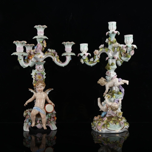 1241 - A pair of 19th century German porcelain 3-branch candelabra, supported by Classical cherubs, blue un... 