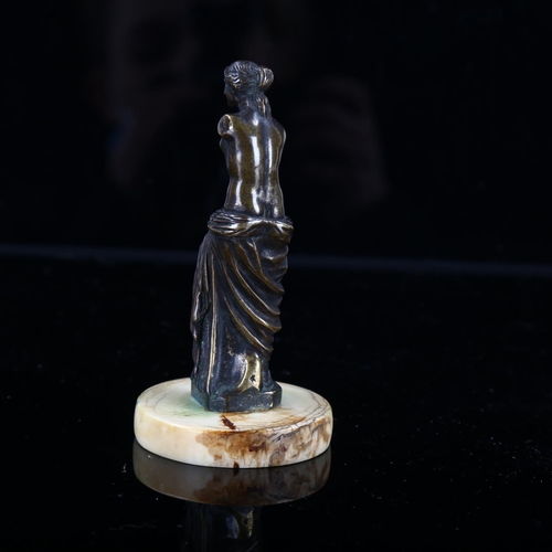 1246 - A 19th century miniature patinated bronze sculpture of Venus on ivory base, height 9cm