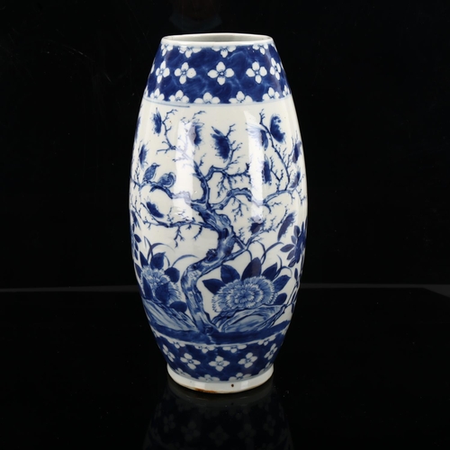 1250 - A Chinese blue and white porcelain vase of bulbous form, hand painted flowers, height 37cm