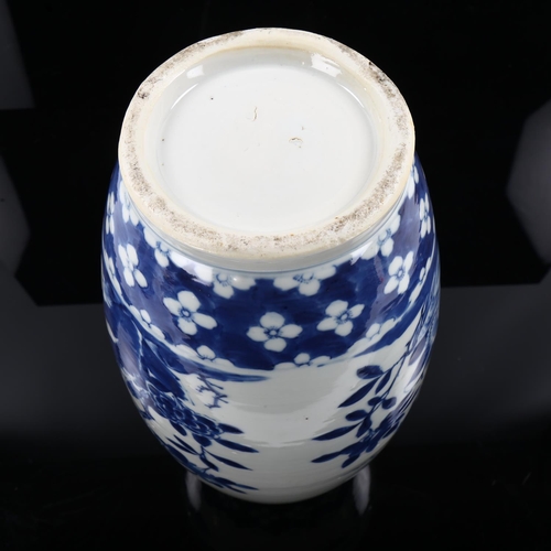 1250 - A Chinese blue and white porcelain vase of bulbous form, hand painted flowers, height 37cm