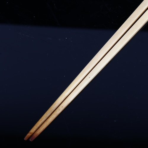 1253 - A Chinese rosewood chopstick case, length 25cm, containing a pair of ivory chopsticks