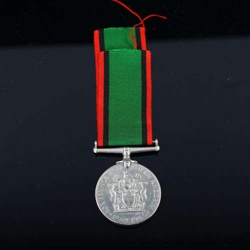 1254 - A George VI medal for service in Southern Rhodesia 1939 - 1945