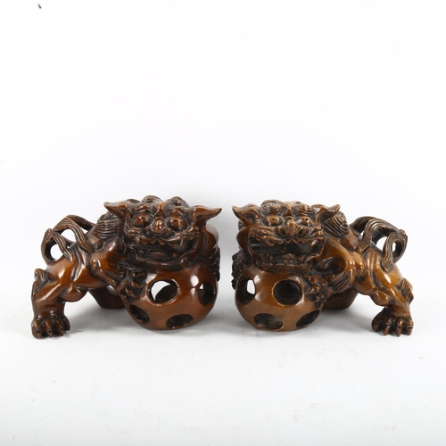 1257 - A pair of Chinese carved wood temple Dogs of Fo, length 20cm