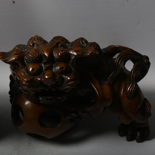 1257 - A pair of Chinese carved wood temple Dogs of Fo, length 20cm