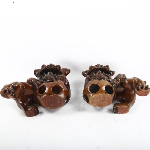 1257 - A pair of Chinese carved wood temple Dogs of Fo, length 20cm