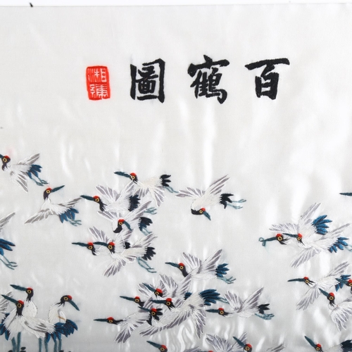 1259 - A Chinese silk embroidered picture, depicting a flock of birds with text inscription, panel size 38c... 