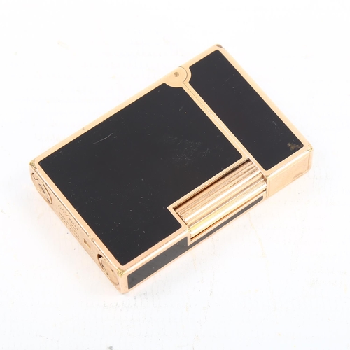 1275 - DUPONT - a gold plated and black enamel pocket lighter, length 5.5cm