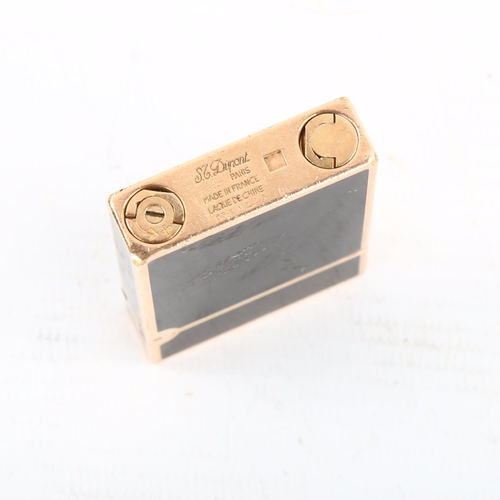 1275 - DUPONT - a gold plated and black enamel pocket lighter, length 5.5cm