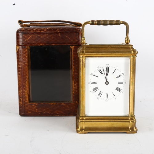 62 - A large French brass-cased carriage clock, white enamel dial with Roman numeral hour markers and exh... 