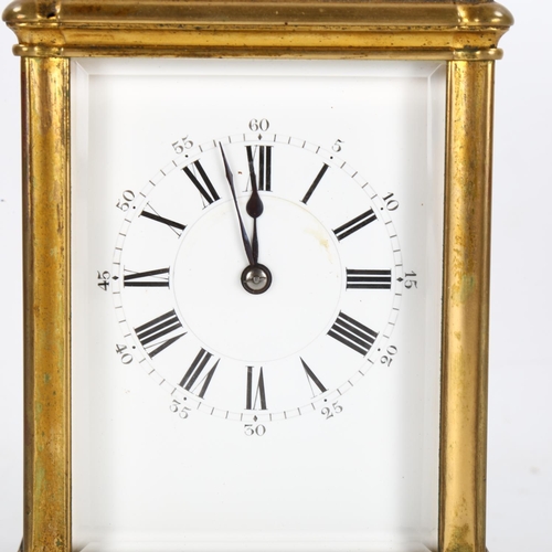 62 - A large French brass-cased carriage clock, white enamel dial with Roman numeral hour markers and exh... 