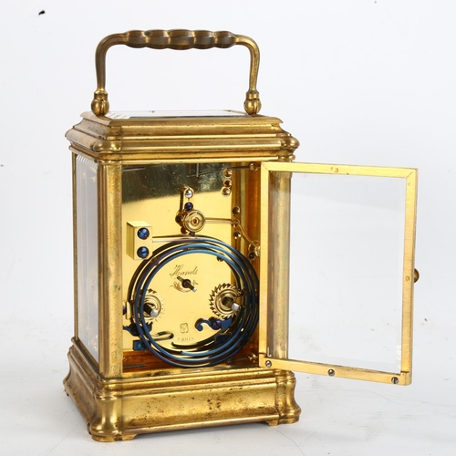 62 - A large French brass-cased carriage clock, white enamel dial with Roman numeral hour markers and exh... 