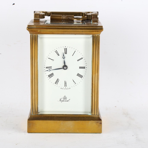 63 - An Imperial brass-cased carriage clock, white enamel dial with Roman numeral hour markers and glass ... 