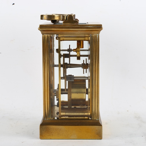 63 - An Imperial brass-cased carriage clock, white enamel dial with Roman numeral hour markers and glass ... 