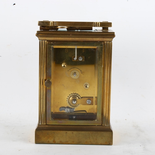 63 - An Imperial brass-cased carriage clock, white enamel dial with Roman numeral hour markers and glass ... 