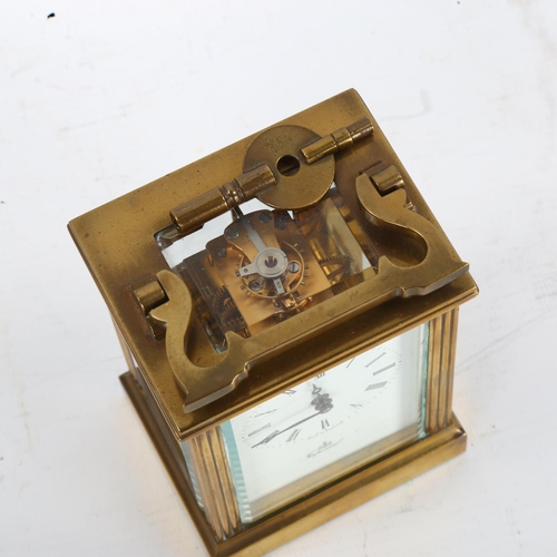 63 - An Imperial brass-cased carriage clock, white enamel dial with Roman numeral hour markers and glass ... 