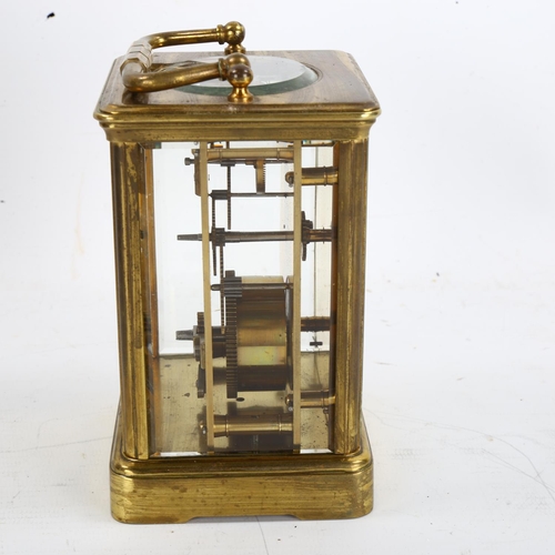 64 - A large brass-cased carriage clock, white enamel dial with Roman numeral hour markers, case height 1... 