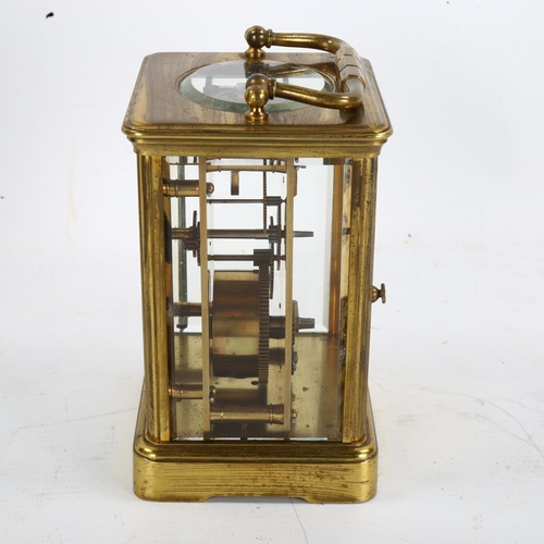 64 - A large brass-cased carriage clock, white enamel dial with Roman numeral hour markers, case height 1... 