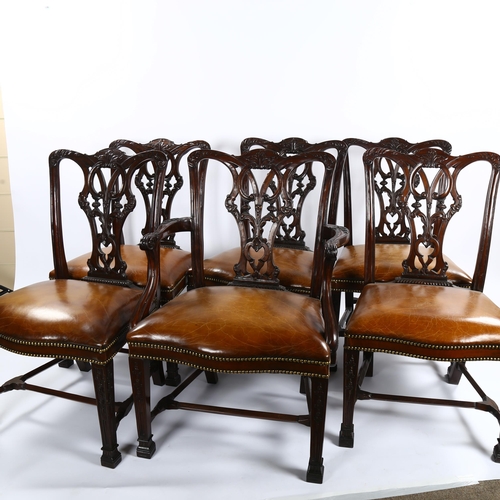 1151 - A set of 12 Chippendale style mahogany dining chairs, with carved and pierced backs and brass studde... 