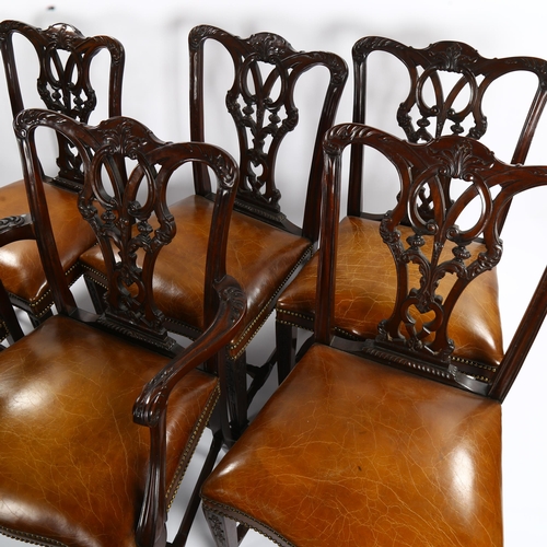 1151 - A set of 12 Chippendale style mahogany dining chairs, with carved and pierced backs and brass studde... 