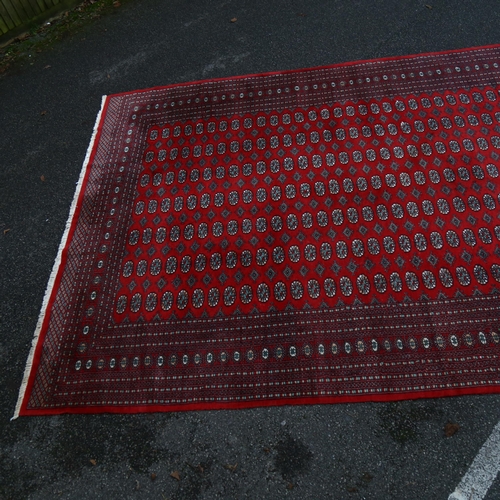 1260 - A large red ground Tekke rug, 380cm x 280cm