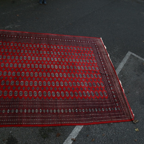 1260 - A large red ground Tekke rug, 380cm x 280cm