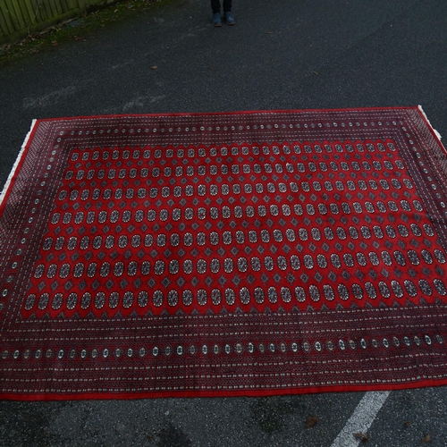 1260 - A large red ground Tekke rug, 380cm x 280cm