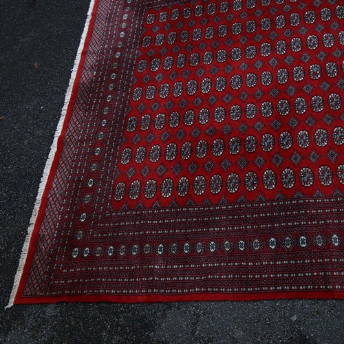 1260 - A large red ground Tekke rug, 380cm x 280cm