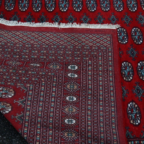 1260 - A large red ground Tekke rug, 380cm x 280cm