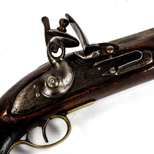 1240 - A flintlock holster pistol, circa 1800, with brass mounts, swivel ramrod length 38cm