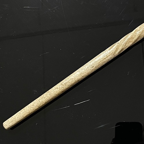 1106 - A 19th century narwhal tusk walking stick, with a carved seal handle and twisted stem, length 87cm, ... 