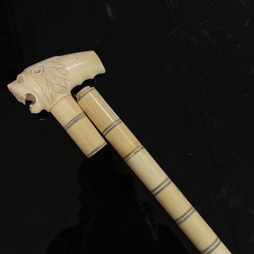 1108 - A 19th century Indian ivory walking stick, the shaft made of separate screw-in tapering sections, an... 