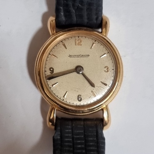 67 - JAEGER LECOULTRE - a lady's Vintage gold mechanical wristwatch, silvered dial with quarterly gilt Ar... 