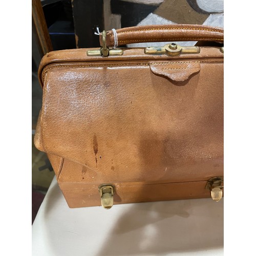 1162 - CARTIER - a Vintage tan leather travelling case, the base opening to reveal a set of fine quality cu... 