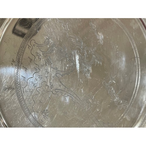 472 - **DESCRIPTION CHANGE** An *American* silver salver, engraved decoration, stamped MET, diameter 24cm,... 