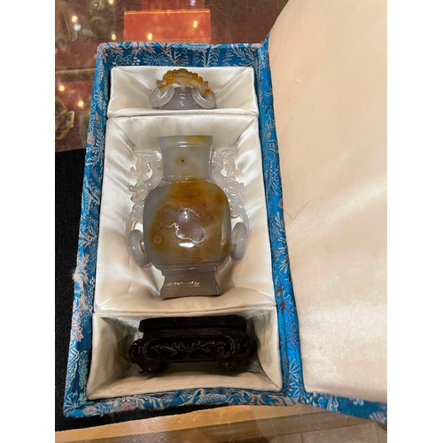 1142 - A Chinese jade/agate square-section vase and cover, carved from a single piece of hardstone, with in... 