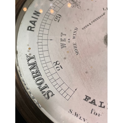 1054 - A Victorian Keen & Frodsham combination barometer / thermometer, in original metal case with bevelle... 