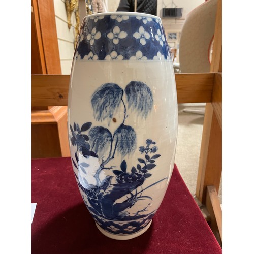 1250 - A Chinese blue and white porcelain vase of bulbous form, hand painted flowers, height 37cm