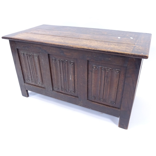 2003 - A stained oak coffer with panelled front, W91cm, H50cm, D46cm