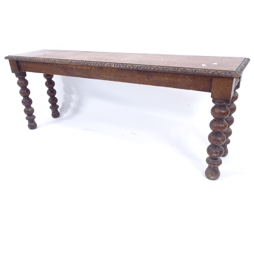 2011 - A Victorian mahogany window seat, on turned legs with carved decoration, L120cm