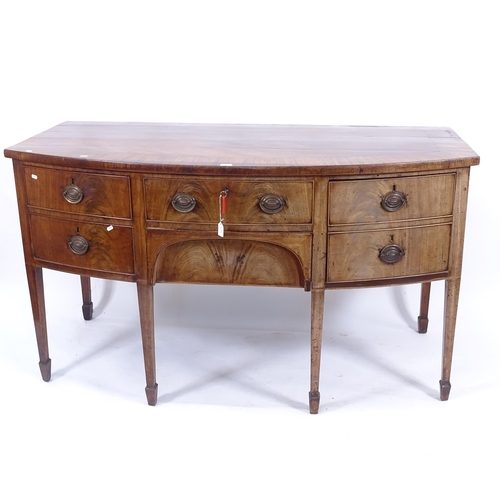 2013 - A George III mahogany crossbanded bow-front sideboard, with 5 fitted drawers with being a cellarette... 