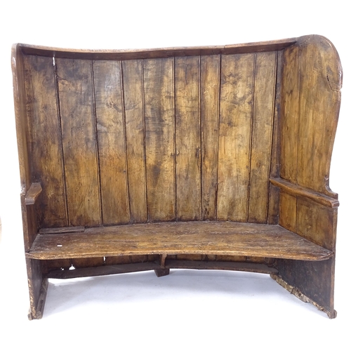 2022 - A large Antique stained pine bow-back settle, H140cm, L165cm