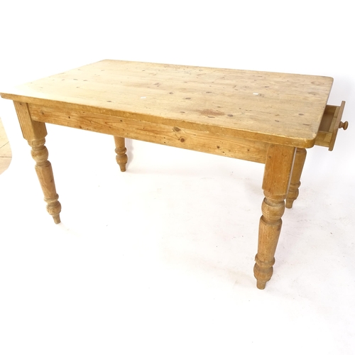 2023 - An Antique stained pine kitchen table, on turned legs, with single end frieze drawer, W140cm, H76cm,... 